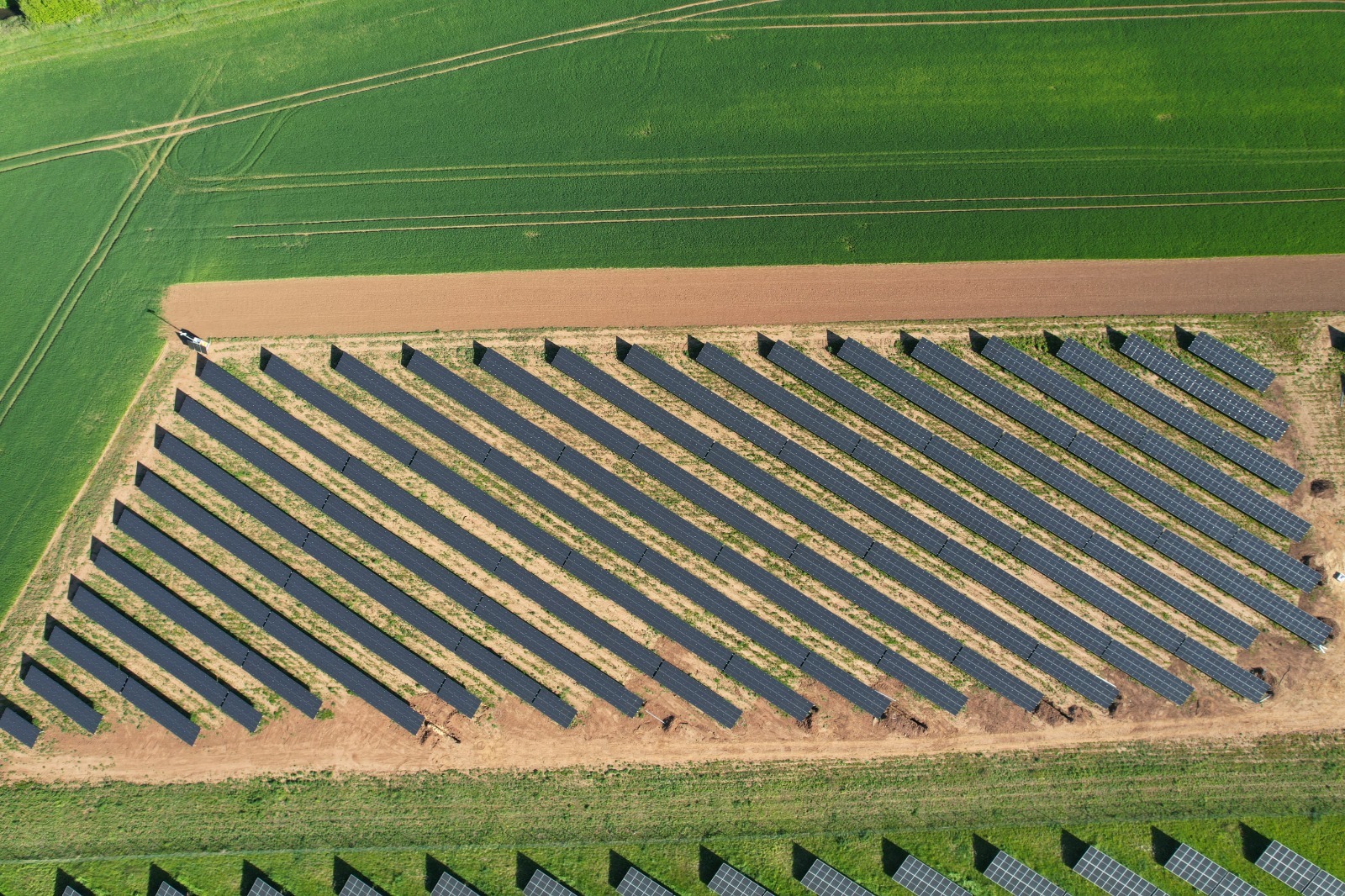 Solar farm with green fields